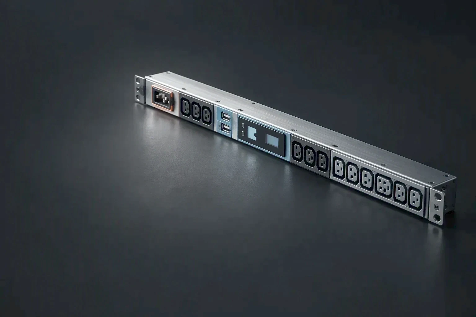A row of IEC C13 and C19 outlet bodies on a rack PDU under one raking light, the sockets held to the right of the frame while the left side stays in clean shadow