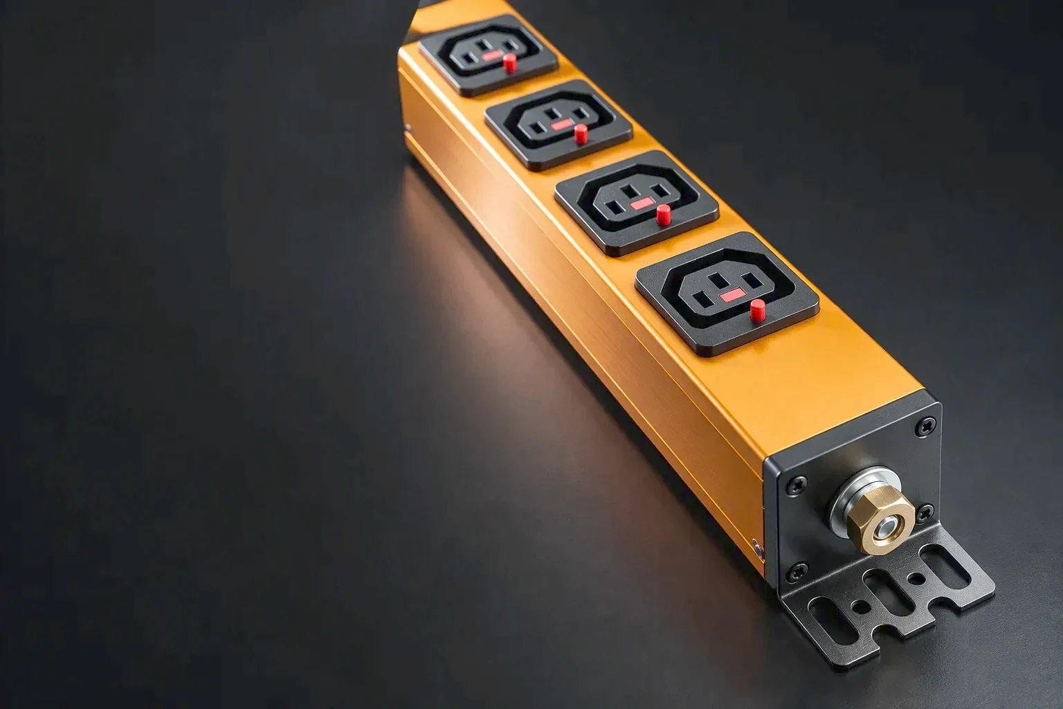 A close view of the metering section of a rack PDU under one raking workbench light, the meter body and a small display held to the right of the frame while the left side stays dark