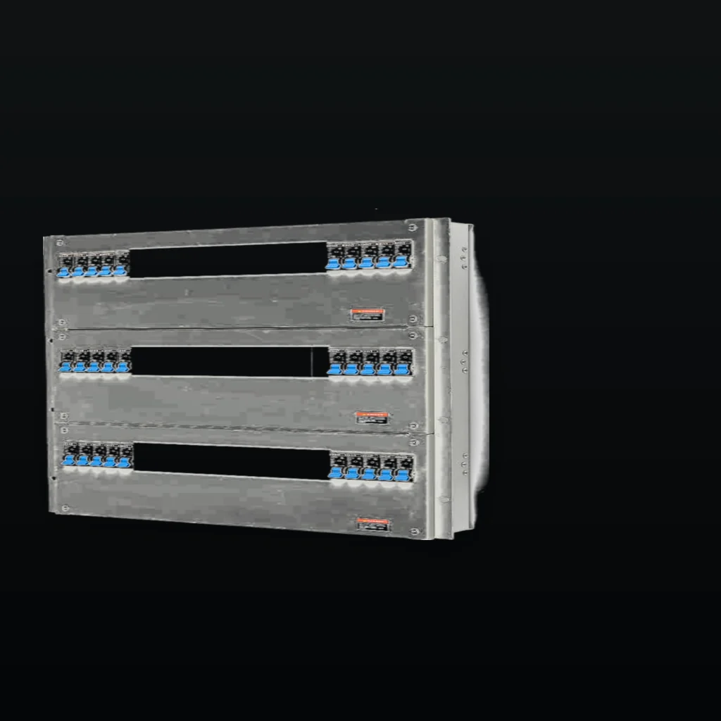 Rack PDU seen from a low three-quarter angle inside a dark equipment aisle, rack rails receding out of focus behind it, held in the left of the frame