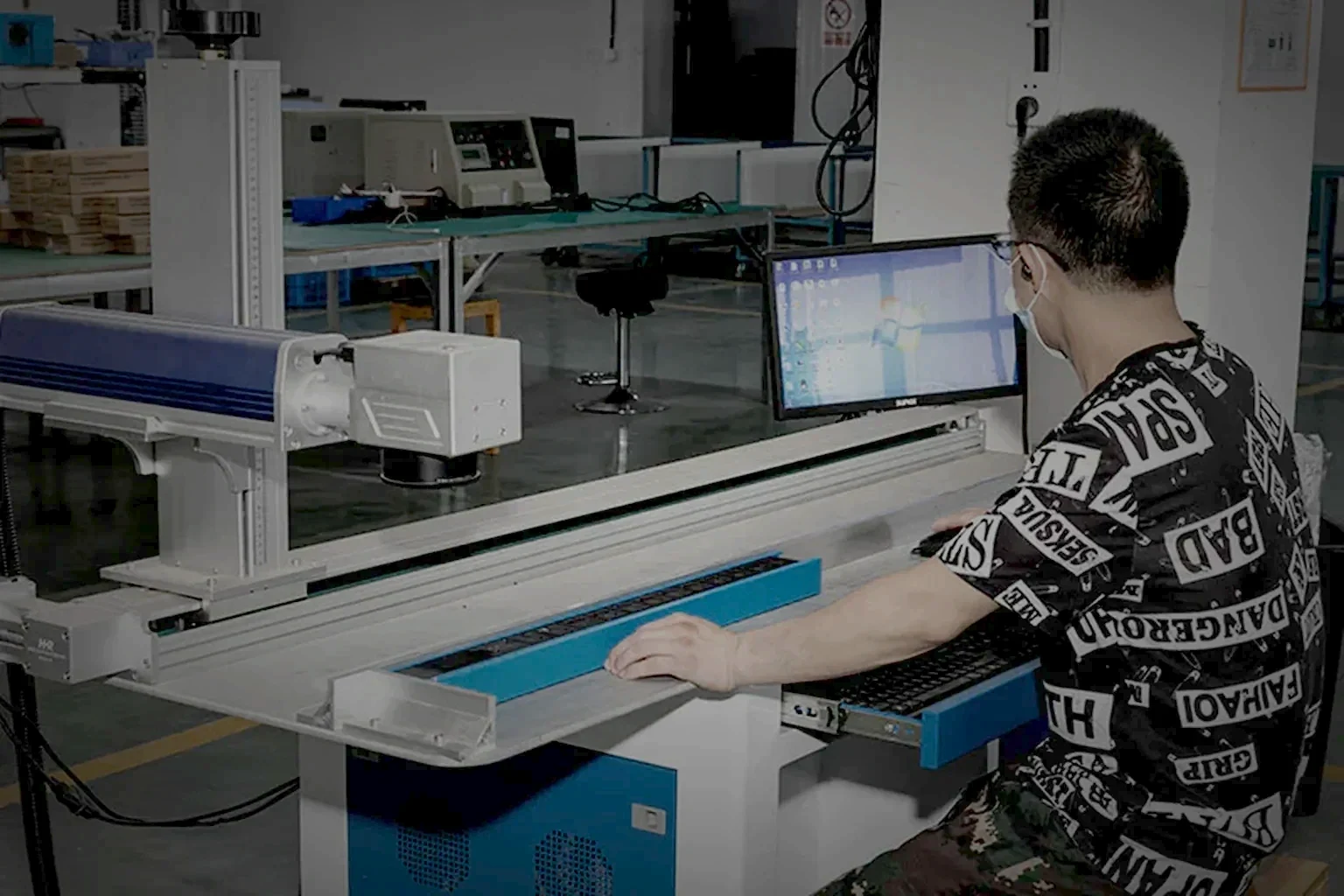 A dark equipment aisle with a rack PDU and its ambient sensor held at the left of the frame under one raking light, the right of the frame left as clean unlit space