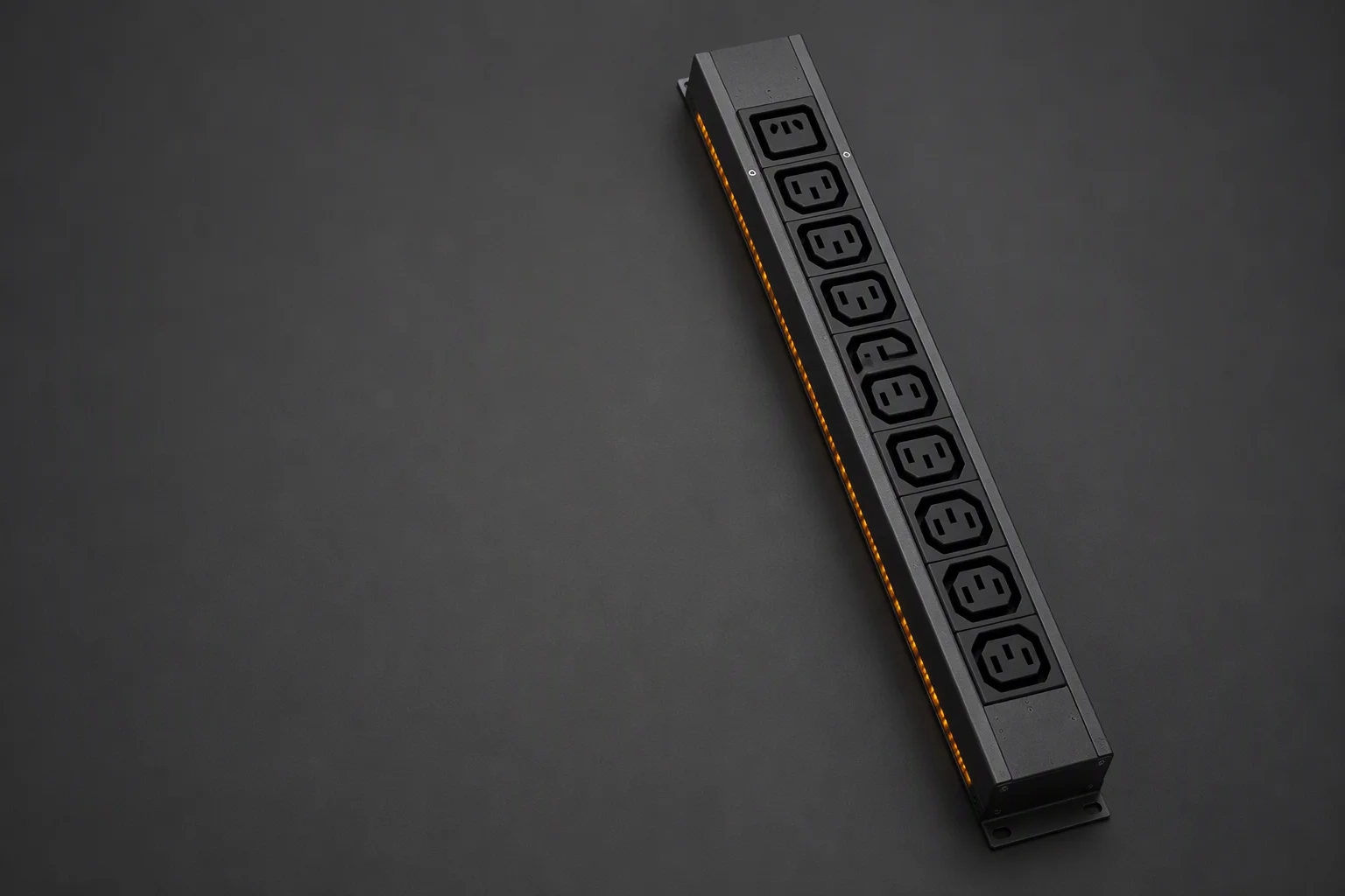 Close-up of rack PDU outlet groups with amber status LEDs in a dark server rack